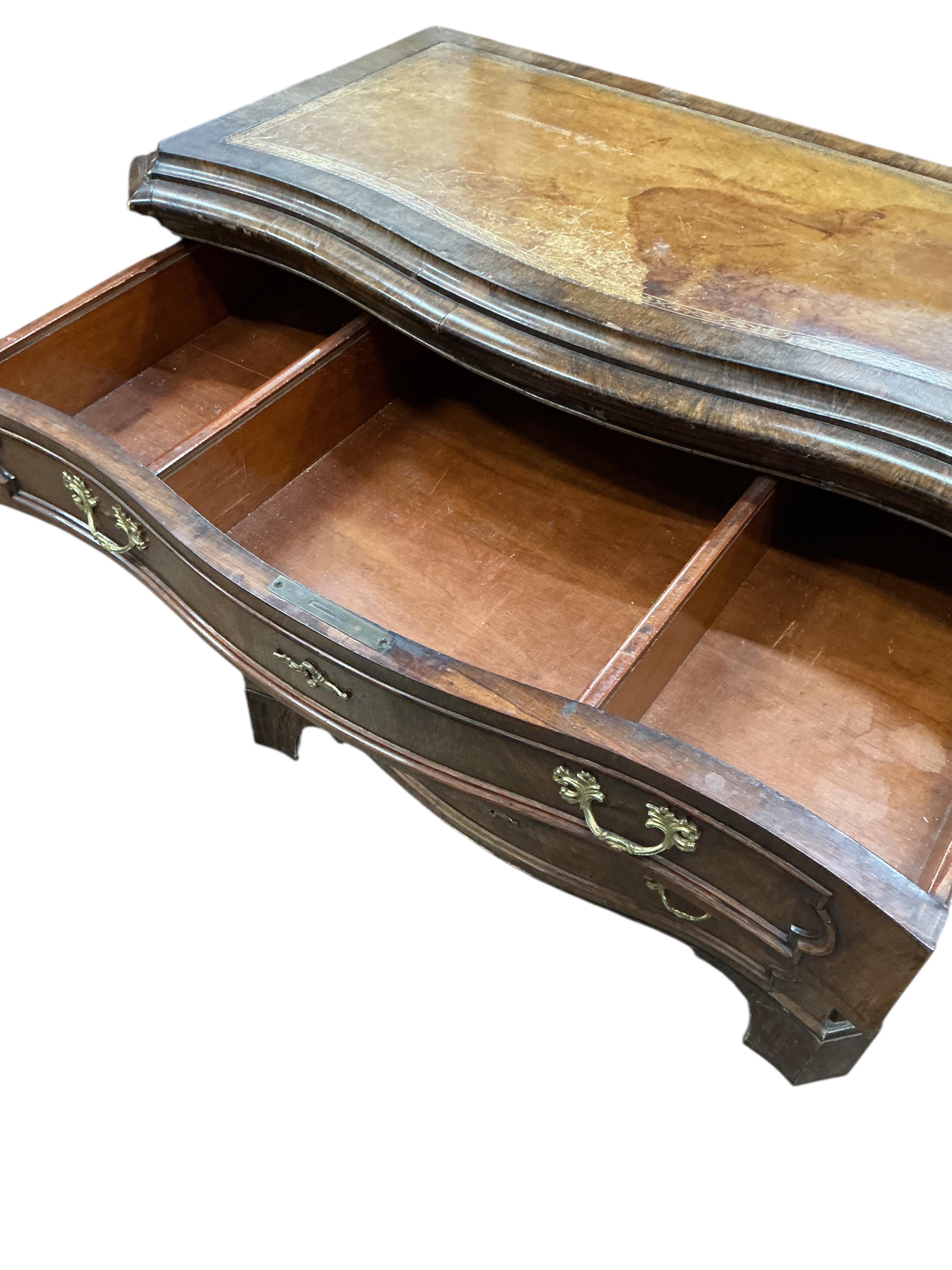 A 19th century French rosewood serpentine chest of drawers, with leather inset top, width 112cm, depth 56cm, height 95cm